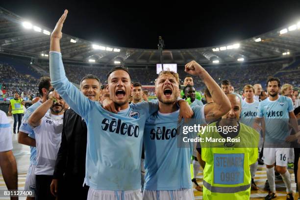 Alessandro Murgia and Ciro Immobile of SS Lazio with the cup after the Italian Supercup match between Juventus and SS Lazio at Stadio Olimpico on...