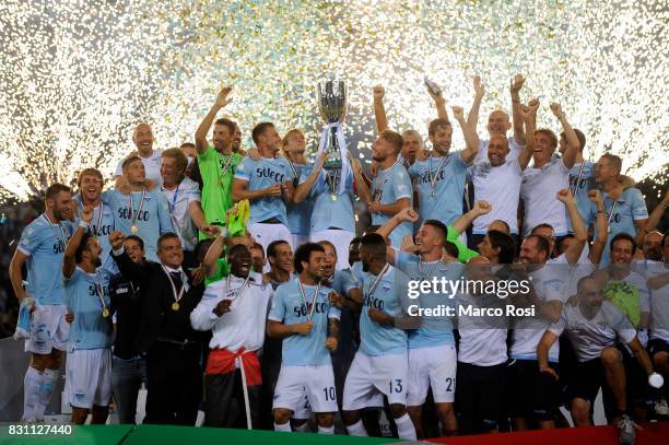 All team with the cup after the Italian Supercup match between Juventus and SS Lazio at Stadio Olimpico on August 13, 2017 in Rome, Italy.