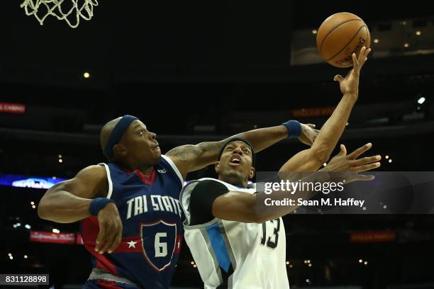 Jerome Williams of the Power throws up a shot against Bonzi Wells of the Tri-State during week eight of the BIG3 three on three basketball league at...