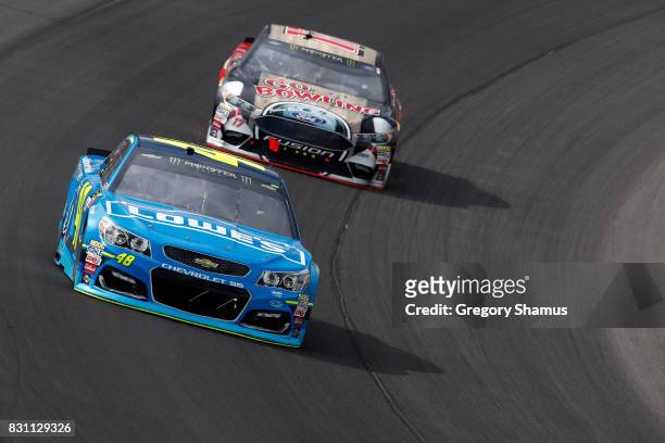 Jimmie Johnson, driver of the Lowe's/Jimmie Johnson Foundation Chevrolet, leads Ricky Stenhouse Jr., driver of the Go Bowling Ford, during the...