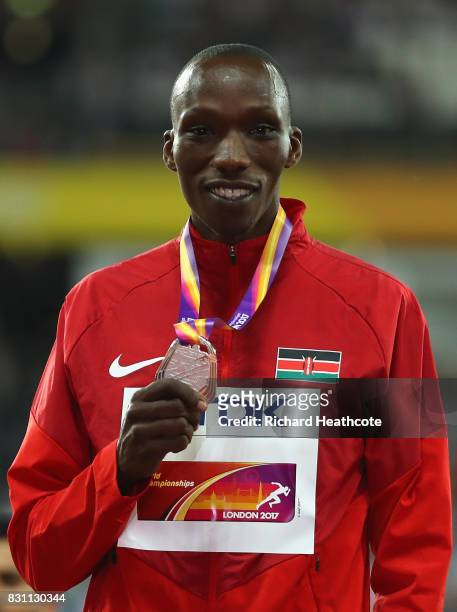 Timothy Cheruiyot of Kenya poses on the podium with his silver medal for the Men's 1500m Final during day ten of the 16th IAAF World Athletics...