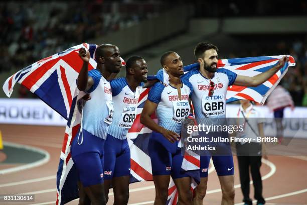 Matthew Hudson-Smith, Dwayne Cowan, Rabah Yousif and Martyn Rooney of Great Britain celebrate after winning bronze in the Men's 4x400 Metres Relay...