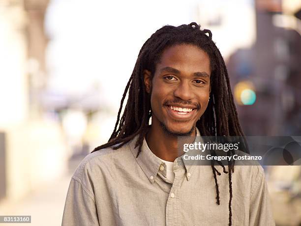 man with dreadlocks, portrait, at sunset - cabello rastafari fotografías e imágenes de stock