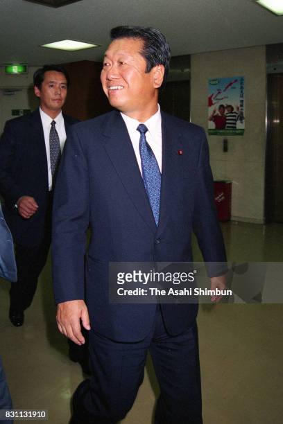 Liberal Democratic Party lawmaker Ichiro Ozawa smiles on arrival at the LDP Politic Reform Promotion meeting after the Lower House is dissolved as...