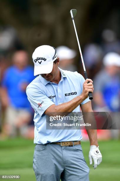 Kevin Kisner of the United States reacts to his shot on the tenth hole during the final round of the 2017 PGA Championship at Quail Hollow Club on...