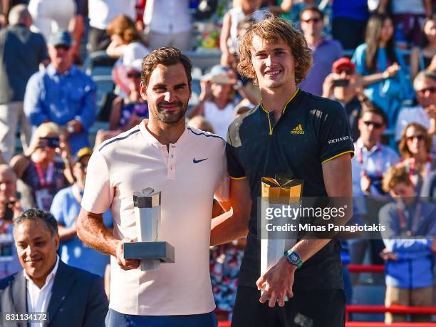 Alexander Zverev of Germany poses with Roger Federer of Switzerland after defeating him 6-3, 6-4 in the final during day ten of the Rogers Cup...