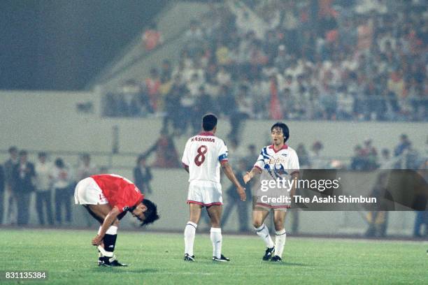 Santos and Yasuto Honda of Kashima Antlers celebrate their 2-0 victory and the J.league first stage champions after the J.League match between Urawa...