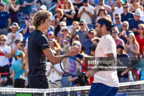 Roger Federer of Switzerland congratulates Alexander Zverev of Germany for his 6-3, 6-4 victory during the final on day ten of the Rogers Cup...