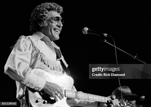 Rockabilly and country singer Carl Perkins performs on October 11, 1986 in Atlanta, Georgia.