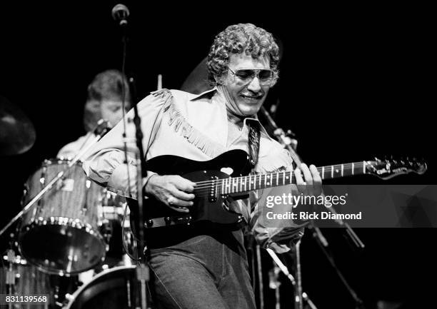 Rockabilly and country singer Carl Perkins performs on October 11, 1986 in Atlanta, Georgia.