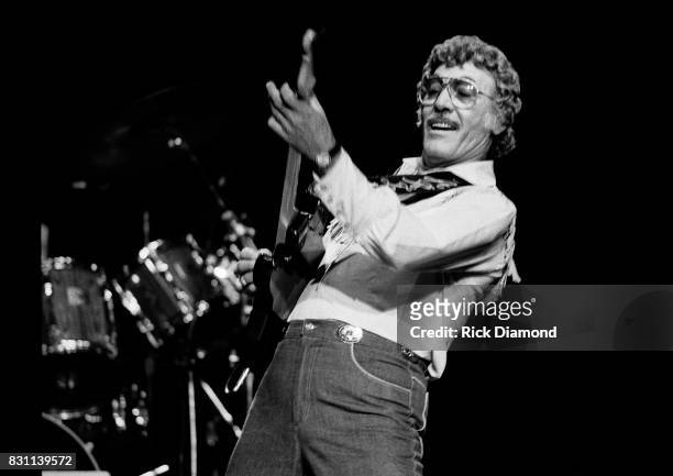 Rockabilly and country singer Carl Perkins performs on October 11, 1986 in Atlanta, Georgia.