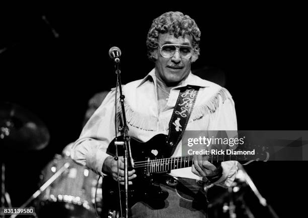 Rockabilly and country singer Carl Perkins performs on October 11, 1986 in Atlanta, Georgia.