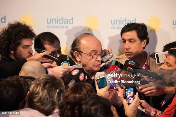 Leopoldo Moreau, candidate for the Unidad Ciudadana party, speaks to members of the media at the party's headquarters during a primary election in...