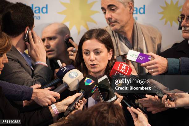 Vanesa Siley, candidate for the Unidad Ciudadana party, speaks to members of the media at the party's headquarters during a primary election in...