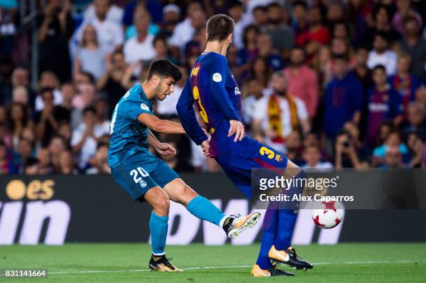 Marco Asensio of Real Madrid CF scores his team's third goal during the Supercopa de Espana Supercopa Final 1st Leg match between FC Barcelona and...