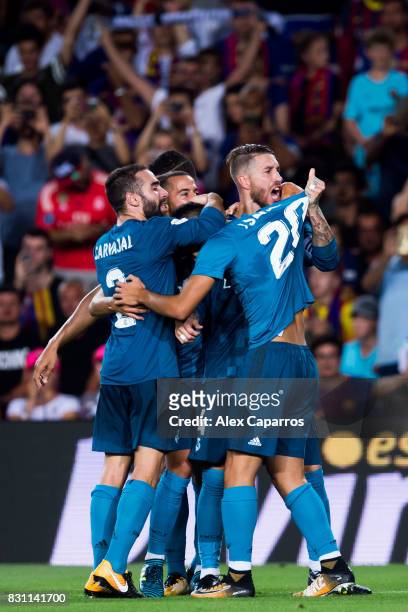 Players of Real Madrid CF celebrate after Marco Asensio scored their team's third goal during the Supercopa de Espana Supercopa Final 1st Leg match...