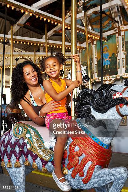 day at an amusement park - carousel horse stock pictures, royalty-free photos & images