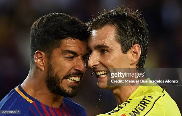 Luis Suarez of Barcelona argues with the referee Ricardo de Burgos Bengotxea during the Supercopa de Espana Supercopa Final 1st Leg match between FC...