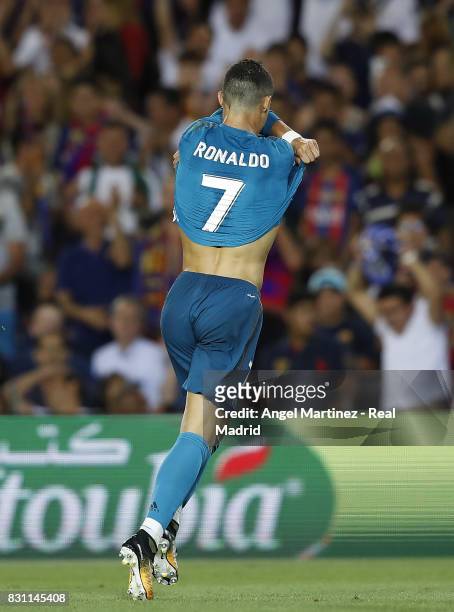 Cristiano Ronaldo of Real Madrid celebrates after scoring his team's second goal during the Supercopa de Espana Final first leg match between FC...