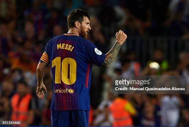 Lionel Messi of Barcelona celebrates scoring his team's first goal during the Supercopa de Espana Supercopa Final 1st Leg match between FC Barcelona...