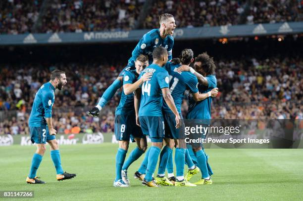 Cristiano Ronaldo of Real Madrid celebrating his score with his teammates during the Supercopa de Espana Final 1st Leg match between FC Barcelona and...