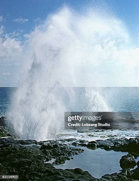 seawater spraying from lava tubes - lava tube stock pictures, royalty-free photos & images