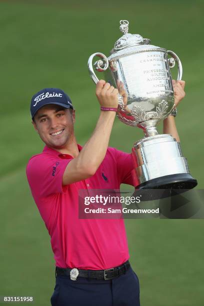 Justin Thomas of the United States poses with the Wanamaker Trophy after winning the 2017 PGA Championship during the final round at Quail Hollow...