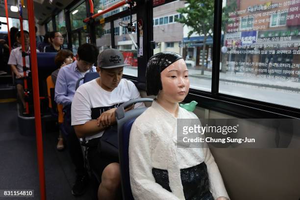 Comfort Woman statue installed in a bus ahead of the 72nd Independence Day on August 14, 2017 in Seoul, South Korea. The statue was originally...