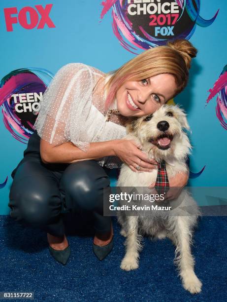 Candace Cameron-Bure and Happy the Dog attend the Teen Choice Awards 2017 at Galen Center on August 13, 2017 in Los Angeles, California.