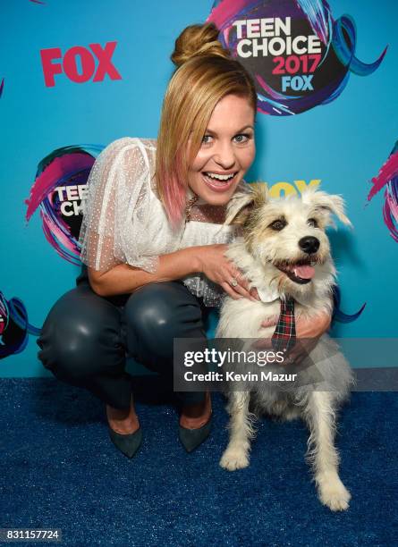 Candace Cameron-Bure and Happy the Dog attend the Teen Choice Awards 2017 at Galen Center on August 13, 2017 in Los Angeles, California.