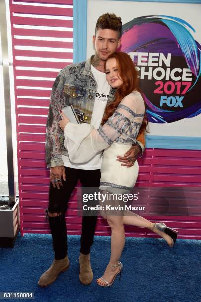 Travis Mills and Madelaine Petsch attend the Teen Choice Awards 2017 at Galen Center on August 13, 2017 in Los Angeles, California.