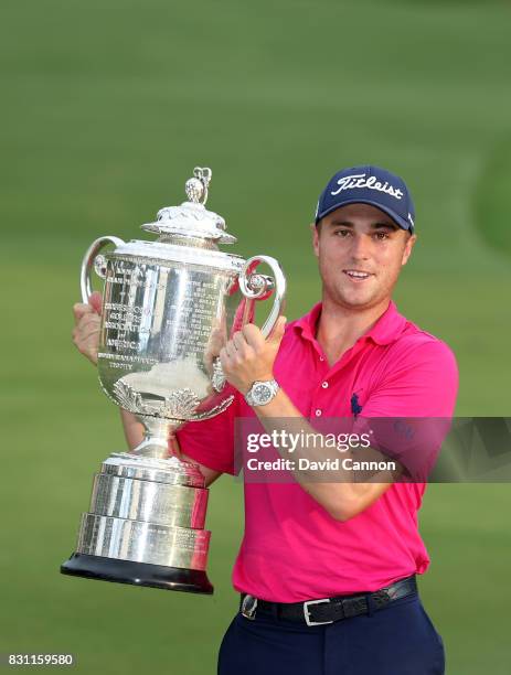 Justin Thomas of the United States holds the Wanamaker Trophy at the presentation after the final round of the 2017 PGA Championship at Quail Hollow...