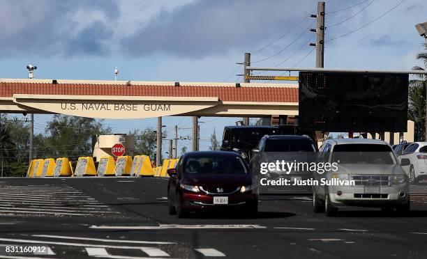 Cars leave the U.S. Naval Base, Guam on August 14, 2017 in Santa Rita, Guam. The American territory of Guam remains on high alert as a showdown...