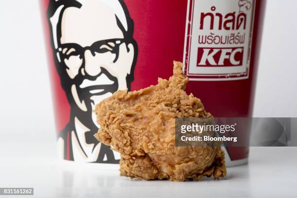 Piece of Yum! Brands Inc. KFC bucket chicken is arranged for a photograph in Bangkok, Thailand, on Friday, Aug. 11, 2017. Thai Beverage, the spirits...