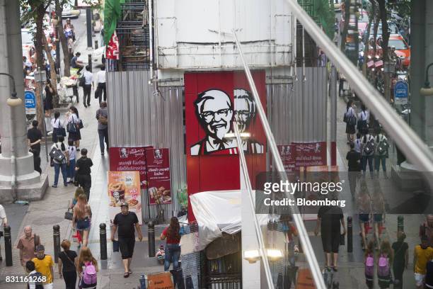 Pedestrians walk past a Yum! Brands Inc. KFC restaurant in Bangkok, Thailand, on Friday, Aug. 11, 2017. Thai Beverage, the spirits giant that makes...