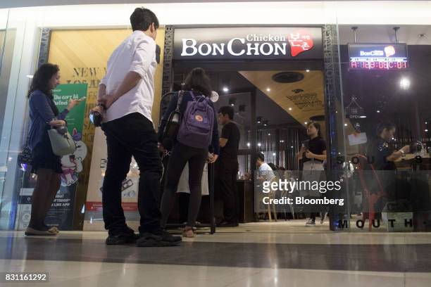 Customers wait to be seated at a Bonchon Chicken restaurant in Bangkok, Thailand, on Friday, Aug. 11, 2017. Thai Beverage, the spirits giant that...