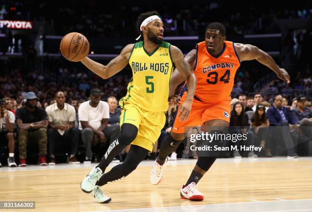 Xavier Silas of the Ball Hogs dribbles past Michael Sweetney of 3's Company during week eight of the BIG3 three on three basketball league at Staples...