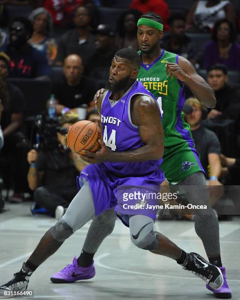 Kwame Brown of the 3 Headed Monsters guards Ivan Johnson of Ghost Ballers during the BIG3 game at Staples Center on August 13, 2017 in Los Angeles,...