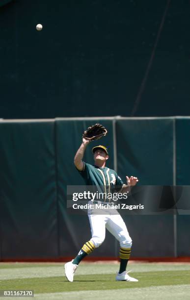Jaycob Brugman of the Oakland Athletics fields during the game against the Tampa Bay Rays at the Oakland Alameda Coliseum on July 19, 2017 in...