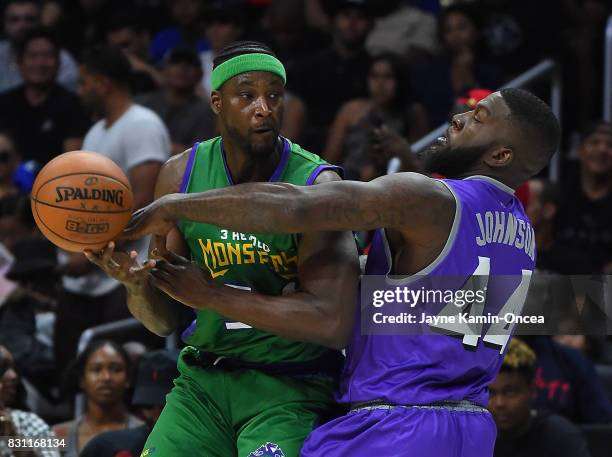 Ivan Johnson of Ghost Ballers guards Kwame Brown of the 3 Headed Monsters during the BIG3 game at Staples Center on August 13, 2017 in Los Angeles,...