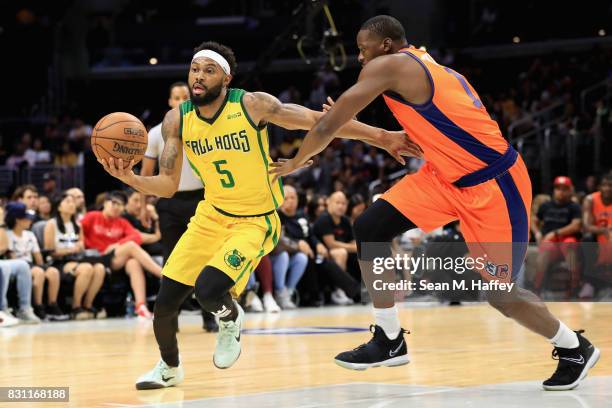 Xavier Silas of Ball Hogs dribbles past Al Thornton of 3's Company during week eight of the BIG3 three on three basketball league at Staples Center...