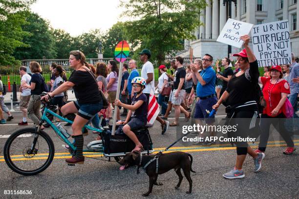 Demonstrators march on August 13, 2017 in Washington, DC to a statue of Confederate General Albert Pike, the only member of the Confederate military...