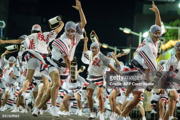 This photo taken on August 13, 2017 shows dancers performing during the Awa Odori festival in Tokushima. The four-day dance festival attracts more...