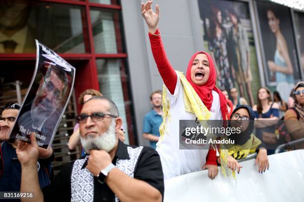 Girl gestures during a protest marking the fourth anniversary of Rabaa El Adaweya massacre in Times Square of Manhattan borough of New York, United...