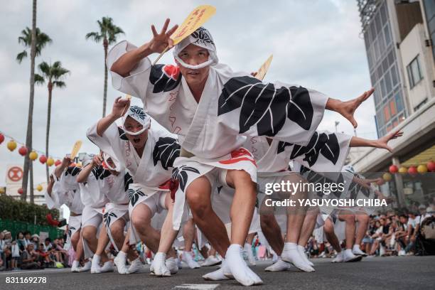 This photo taken on August 13, 2017 shows Eiji Ohmatsudani of the Sasa-ren leading dancers on a street during the Awa Odori festival in Tokushima. -...