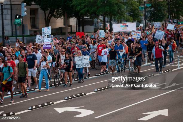 Demonstrators march August 13, 2017 to a statue of Confederate General Albert Pike, the only member of the Confederate military with an outdoor...