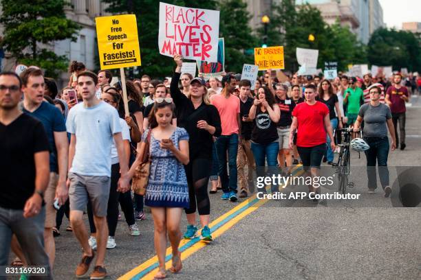 Demonstrators march August 13, 2017 to a statue of Confederate General Albert Pike, the only member of the Confederate military with an outdoor...