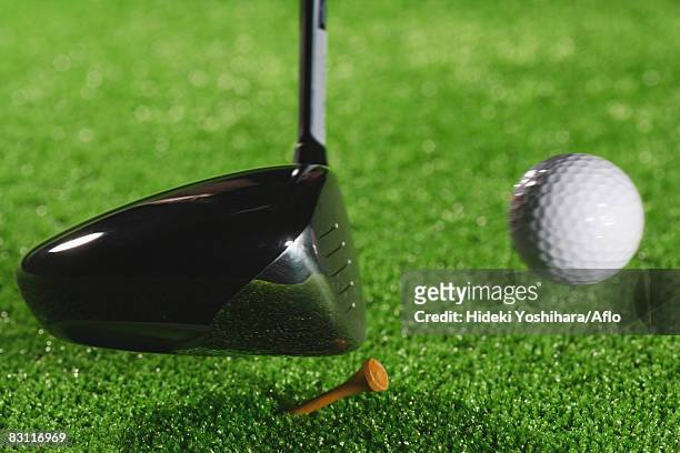 teeing off - golf swing close up stock pictures, royalty-free photos & images