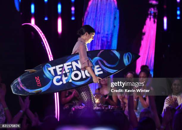 Vanessa Hudgens walks offstage with the #SeeHer Award during the Teen Choice Awards 2017 at Galen Center on August 13, 2017 in Los Angeles,...