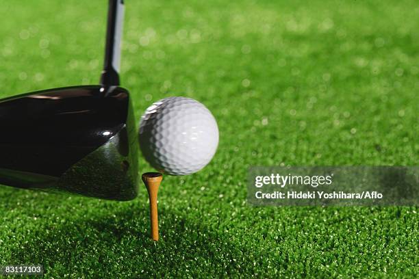 teeing off - golf swing close up stock pictures, royalty-free photos & images